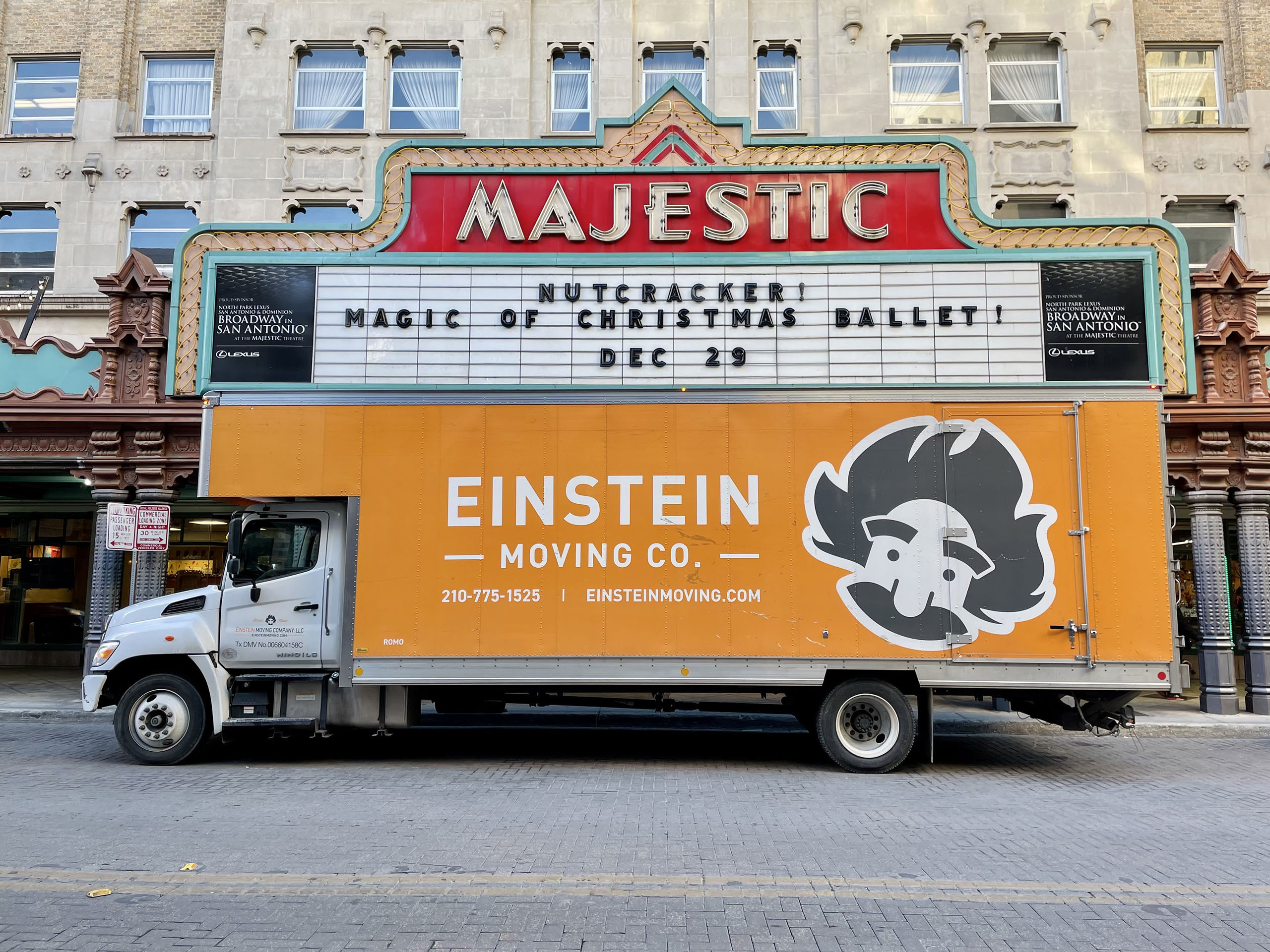 Orange, Einstein Moving Company, branded moving truck