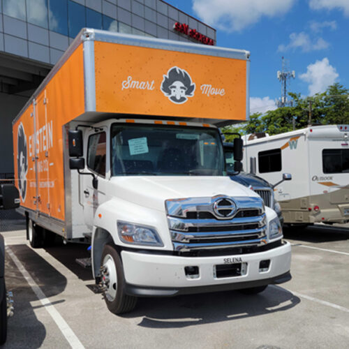Moving truck parked in a parking lot in miami.